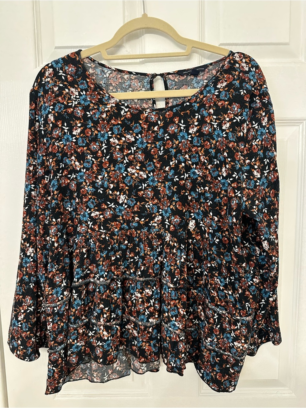 Floral Peplumβ Long-Sleeve Top in Black and Teal